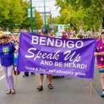 Picture of the Bendigo Have A Say Group holding up a banner at an event