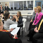 Picture of a committee meeting with Deaf Blind Victoria who are signing during meeting with Julia Gillard