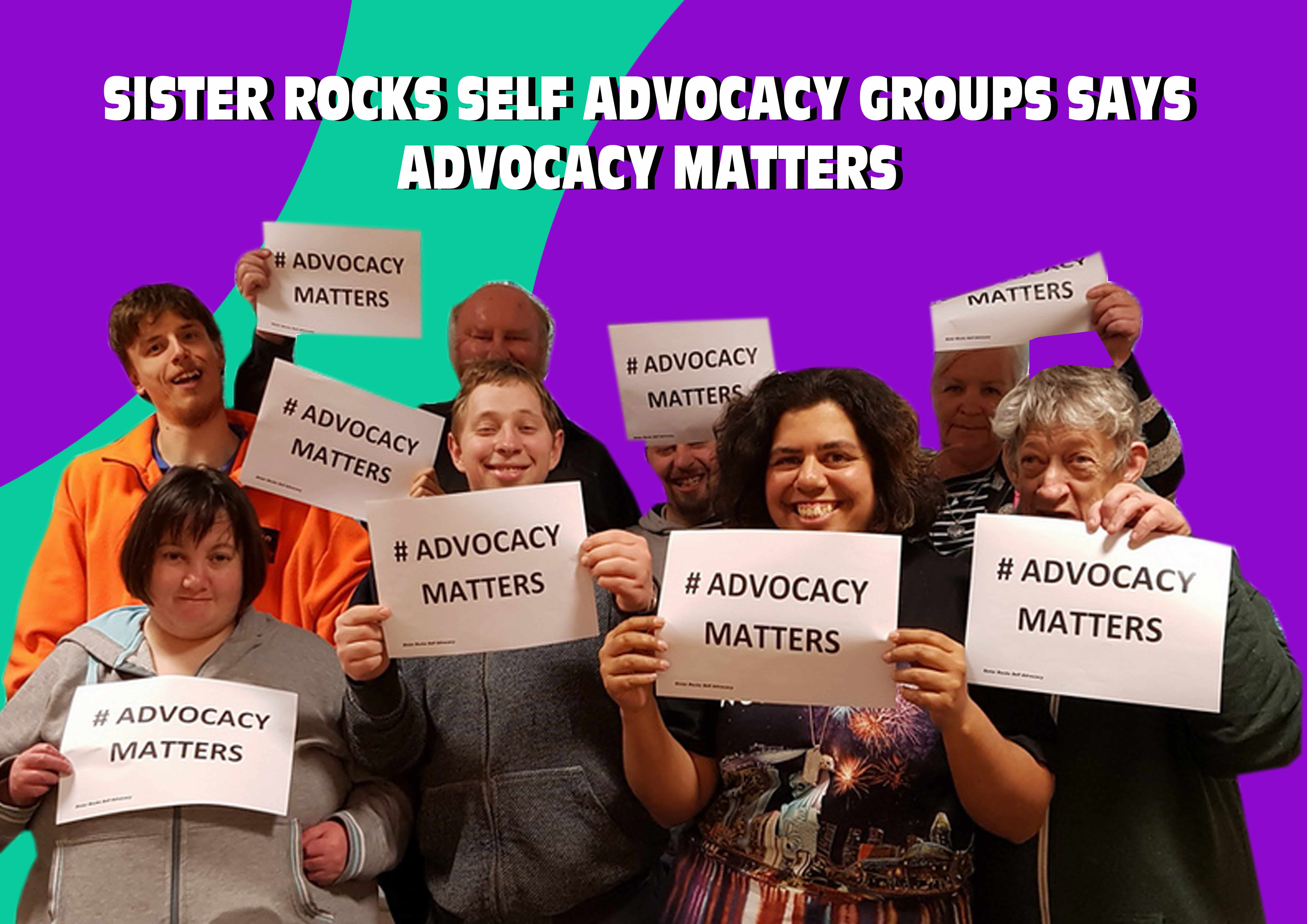 Picture of Sister Rocks Self Advocacy committee holding signs