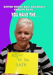 sister rocks committee member holding up sign 'right to be safe'